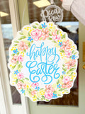 Decorative sign with 'Happy Easter' text and floral design on a door.