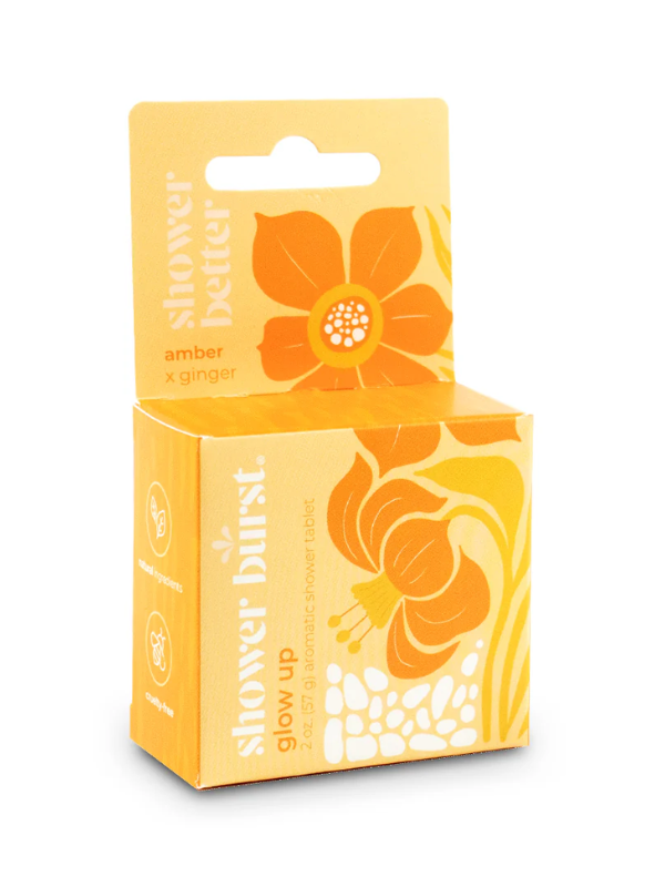 Yellow shower steamer with floral design and text on a white background