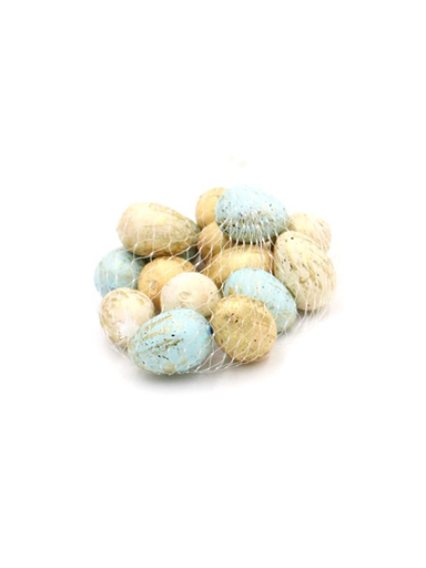 Assorted pastel-colored decorative eggs in a mesh bag