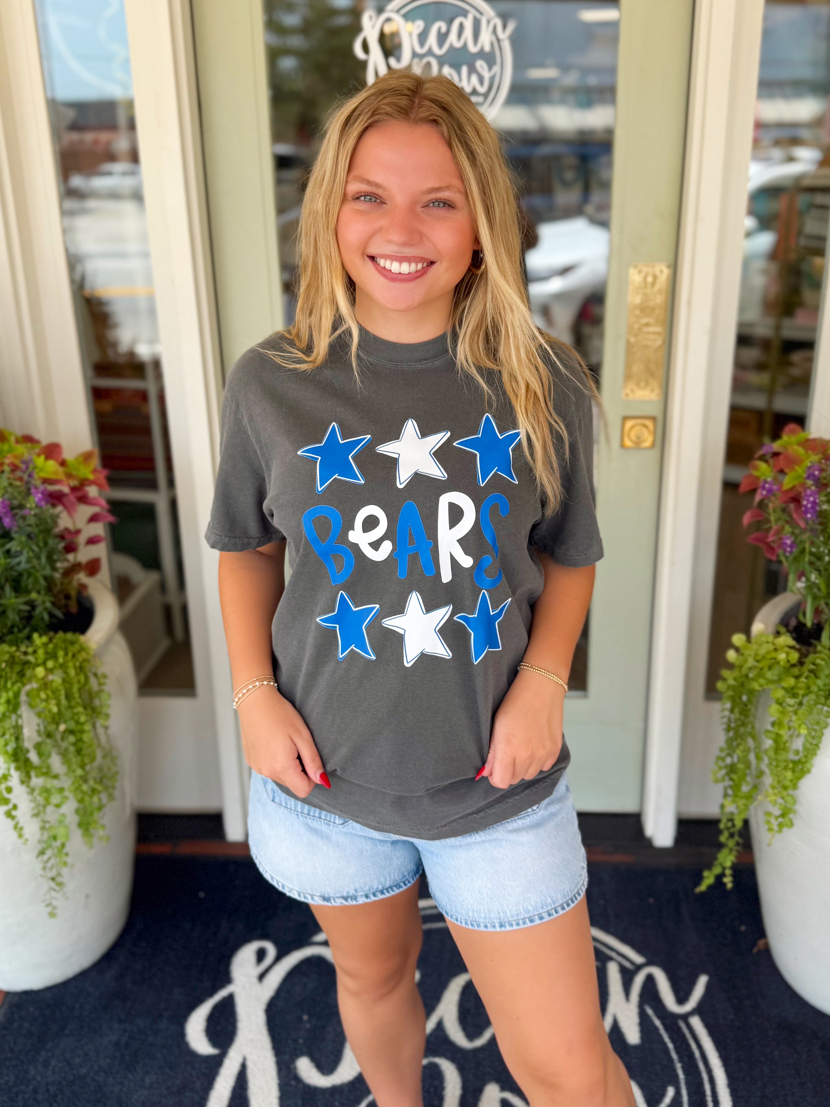 A dark gray graphic t-shirt with blue and white stars and the word 'BEARS' printed on the front