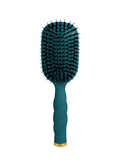 A paddle hairbrush with a textured teal handle and a dark teal bristle head, finished with a gold accent ring at the base