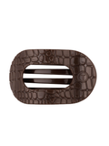 A dark brown textured hair claw clip with a crocodile skin pattern
