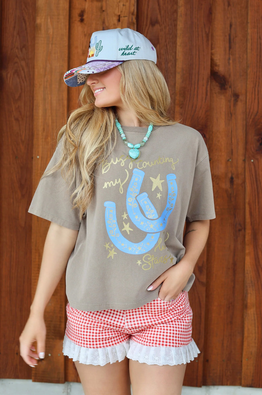 Busy Counting My Lucky Stars Tee by Poppy and Pine with horse shoes and stars on it 