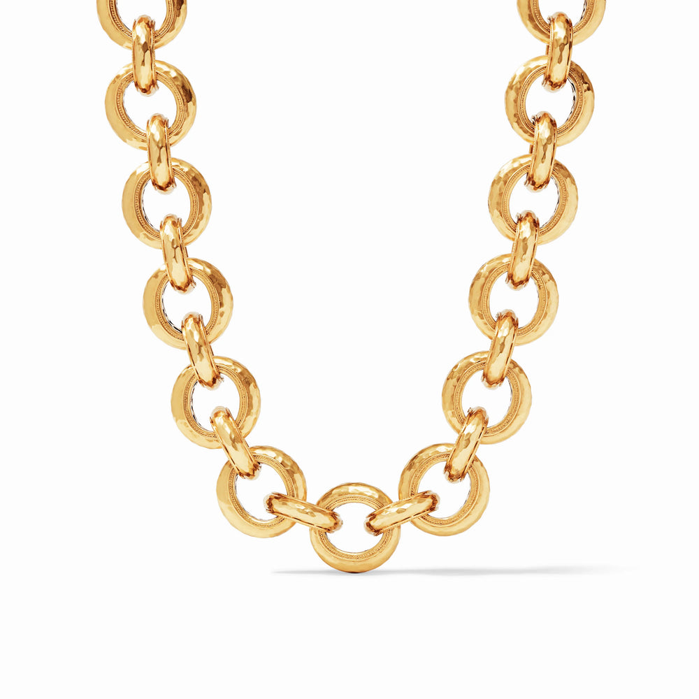 An elegant necklace of lightly hammered golden links featuring a splendid pierced design on the inside and finished with a toggle.