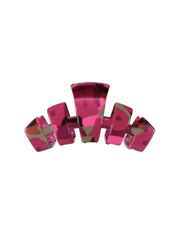 A glossy, pink hair claw clip with a camo pattern on it