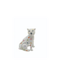 A white ceramic match holder in the shape of a sitting leopard with multicolored spots.