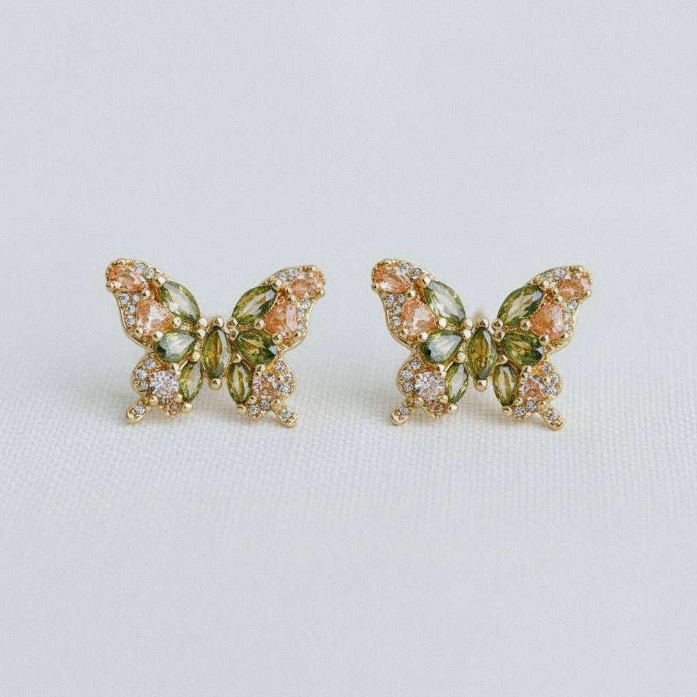 Butterfly shaped stud earrings with green gemstones 