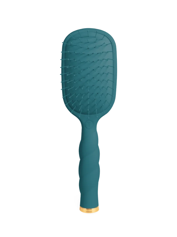 A teal paddle hairbrush with a textured silicone bristle head and a twisted grip handle, finished with a gold accent ring at the base