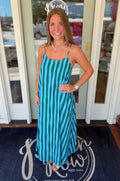 Turquoise and emerald green striped maxi dress featuring adjustable spaghetti straps, a relaxed silhouette, and a lightweight flowy design perfect for warm-weather wear.