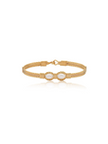 Gold bracelet with a central pearl on a white background