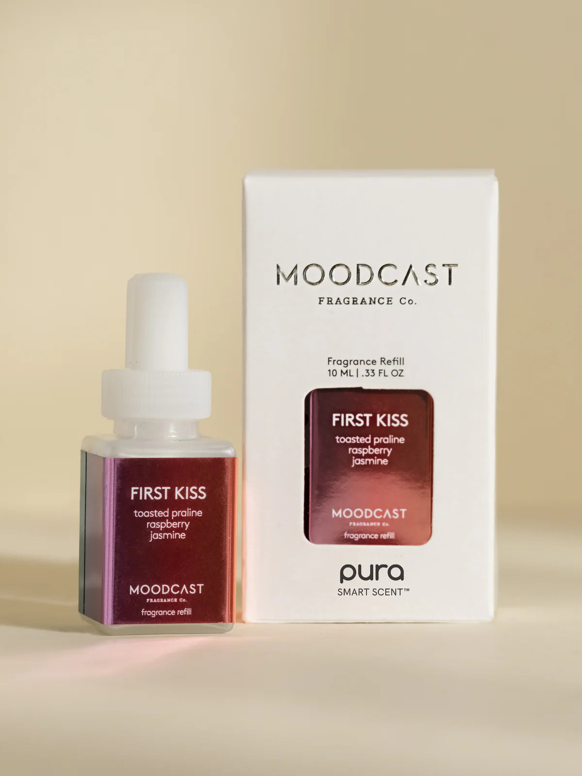 Pura scent with notes of raspberry, jasmine, and toasted praline