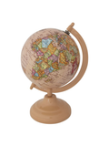 Hazel Mazel enameled plastic decorative globe with vintage-style world map in muted tones on a neutral pedestal stand.