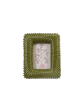 An olive green ribbed square picture frame with a white insert featuring a delicate black floral line drawing and a small pink vase at the bottom.