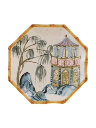 Decorative plate with a scenic design of a pagoda and tree on a white background