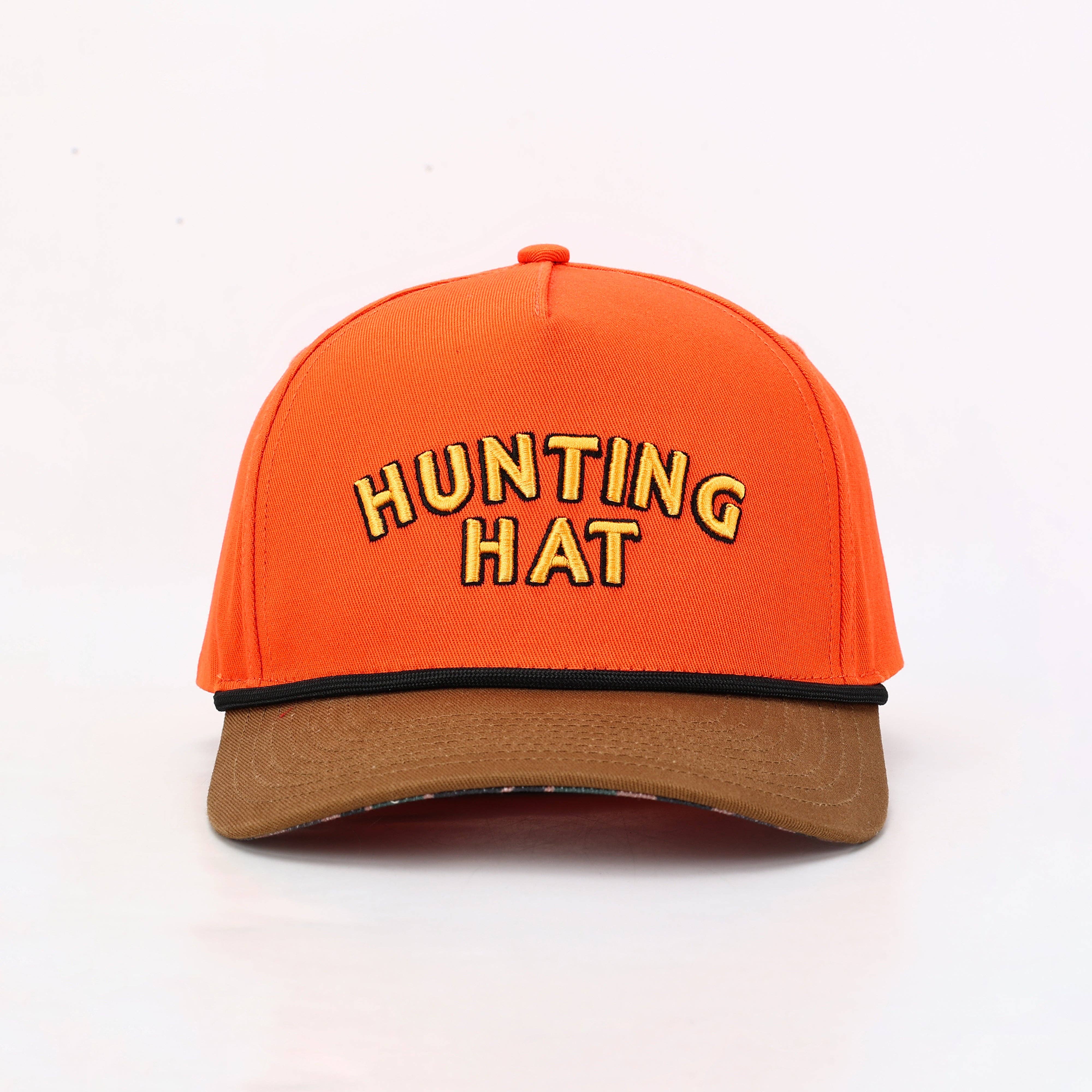 An orange baseball cap with 'HUNTING HAT' embroidered in yellow letters with black outlines on the front, featuring a brown visor and a thin black stripe separating the crown from the visor.