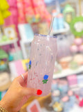 Glass cup with blue hydrangeas on it by swig