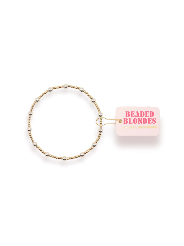 A gold-filled beaded bracelet with silver accent beads