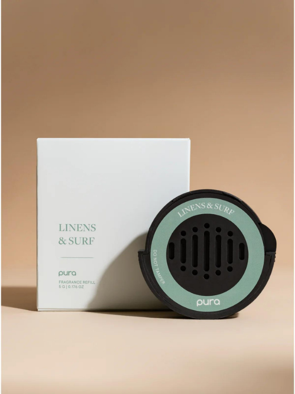 Car fragrance with notes of bergamot, sea spray, ozonic, pear, passionfruit, orange flower, sandalwood, coconut, and creamy jasmine
