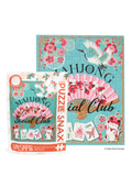 A packaged jigsaw puzzle and its box shown on a white background. The puzzle artwork features a turquoise background with pink cherry blossoms, a pink folding fan, white cranes, playing cards, and a white cat, with the words 'MAHONG Social Club' and 'PUZZLE Club'.