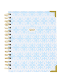 Notebook with blue floral pattern and 'Sermon Notes' text on a white background