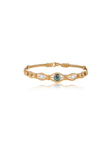 Gold wire bracelet with pearls and a center colorful stone by Ronaldo 