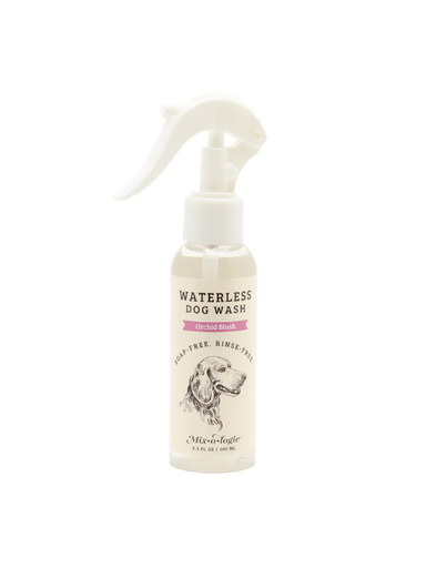 Waterless dog wash spray bottle on a white background