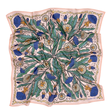 Floral patterned scarf with blue and green design on a beige background