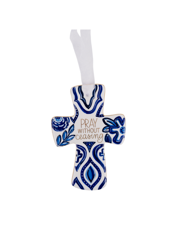 Decorative cross with blue floral patterns and 'Pray without ceasing' text on a white background