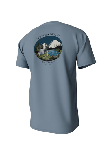 blue tee with a mountain scene on the back of it 