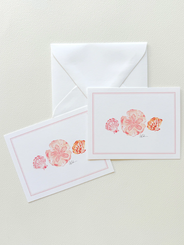 Two stationery items with shell designs on a light background