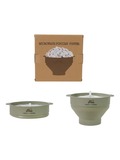 A silicone microwave popcorn popper set shown with its brown cardboard box on a white background. The set includes the assembled olive green popper with a lid