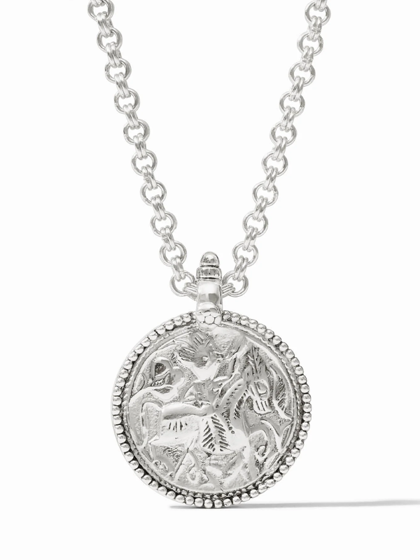 Silver necklace with a detailed pendant on a white background