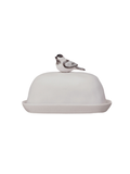 A white ceramic butter dish with a domed lid topped by a small bird figurine