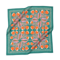 A teal bandana with orange and pink floral patterns, laid flat.