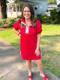 A red short-sleeve puff-sleeve dress with a white and black sailor-style collar, by Mary Square