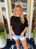 A loose black short-sleeve t-shirt
