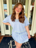 Soft knit top with green thread detail 