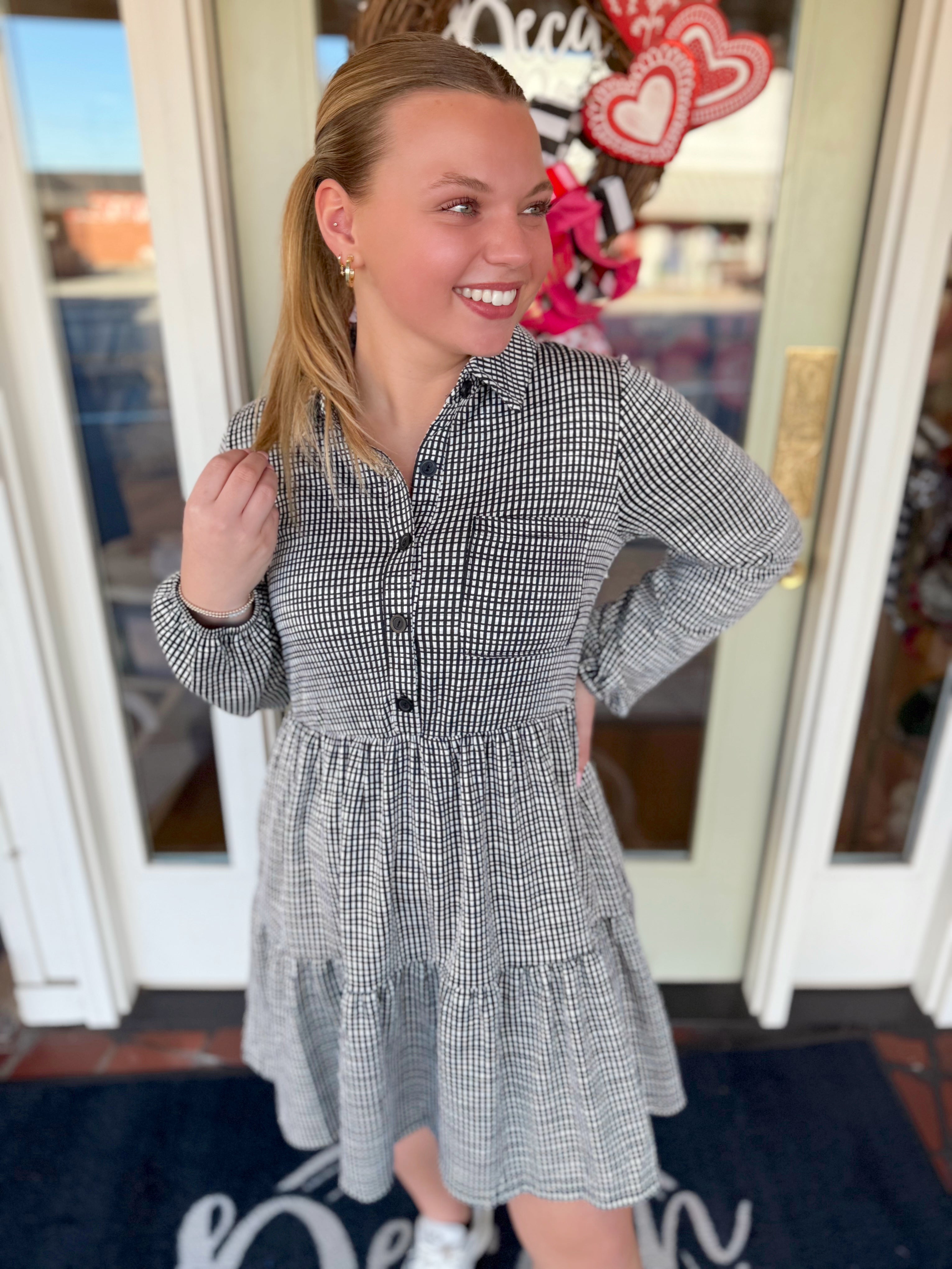 Long sleeve gingham dress with a collar and button detailing 