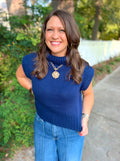 A Navy blue knit mock neck top with cap sleeves