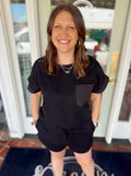 Black short sleeve top with pocket detail on the front 