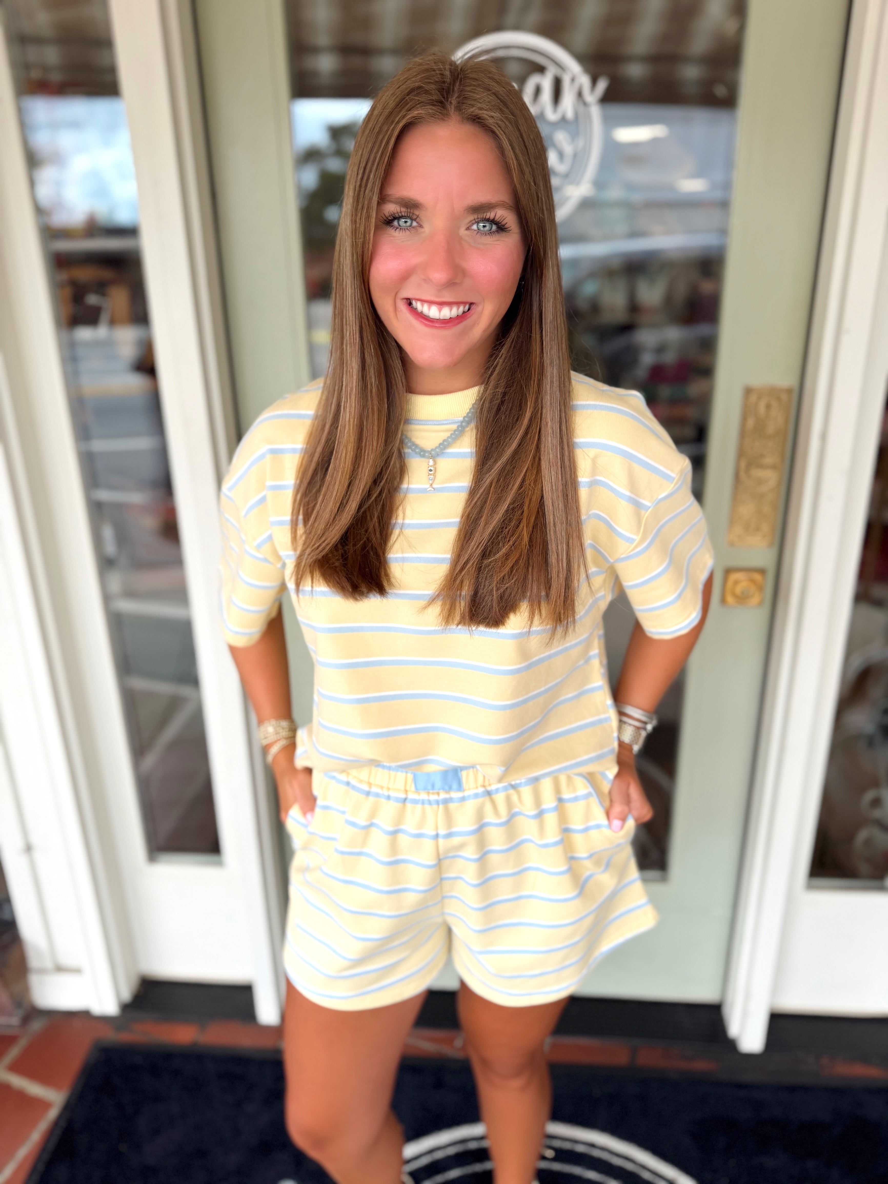 Striped short sleeve henley knit top with dropped shoulders