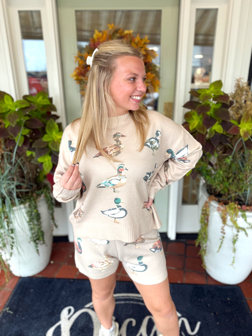 Oatmeal color long sleeve top with printed mallard duck all over it 