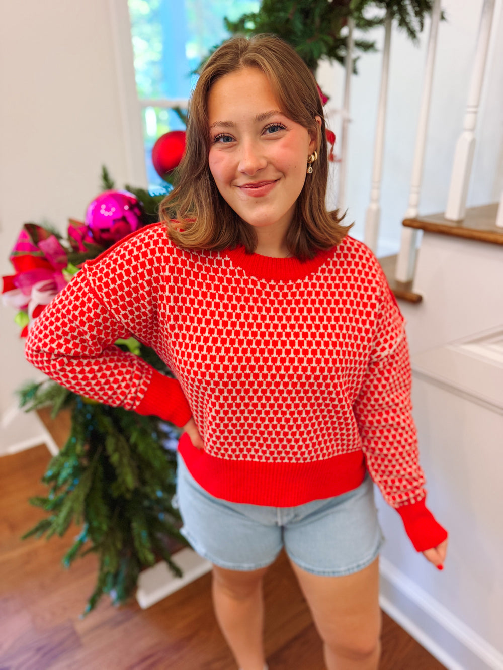 red and white patterned sweater top with slits on the sides