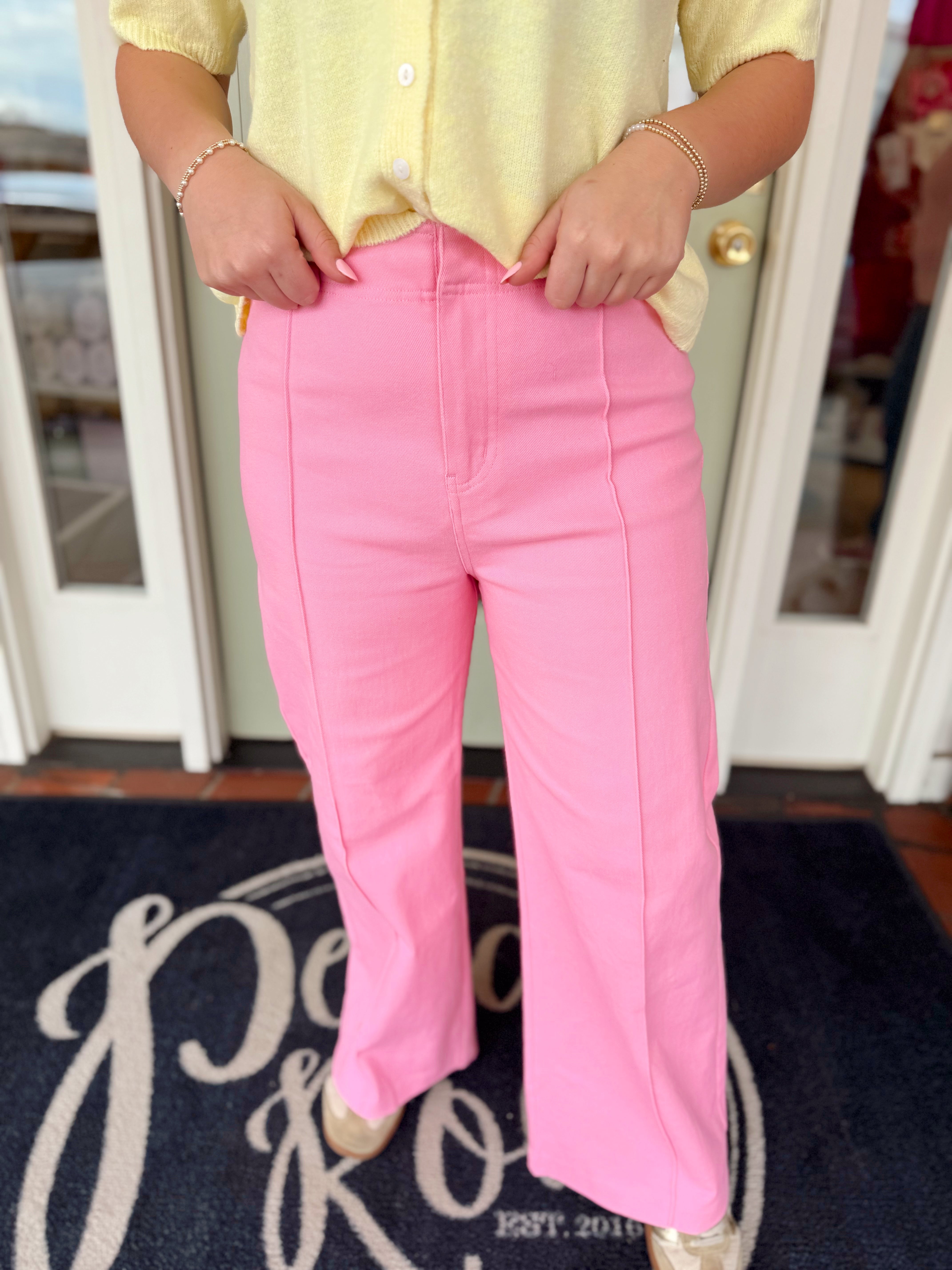 Pink wide leg pants with a seam going down the front 