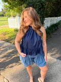 A navy blue halter top with a ruffle bottom