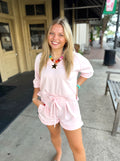 A short-sleeve V-neck knit trim top