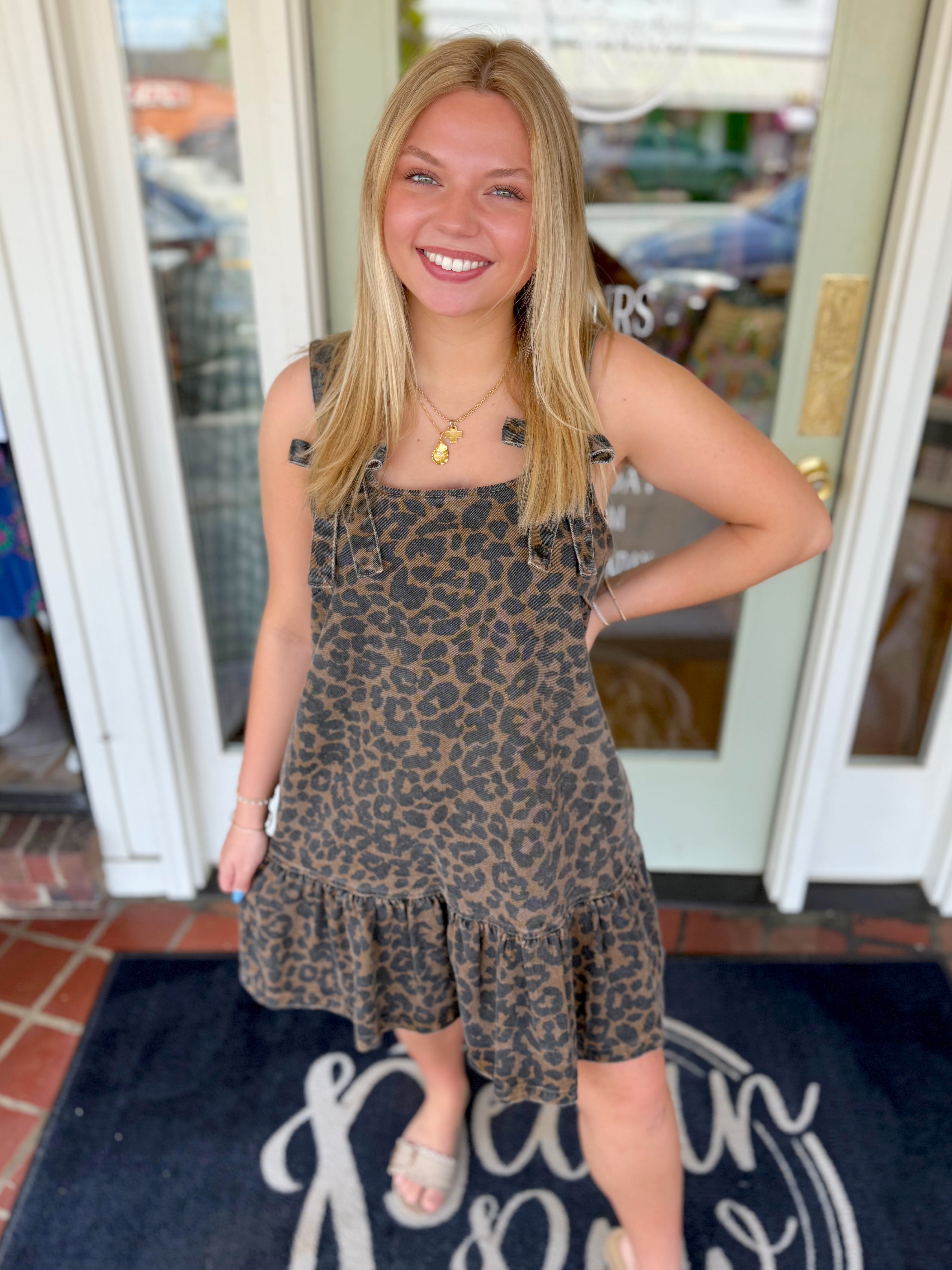 Leopard print dress with ruffle bottom and bow detailing on strap