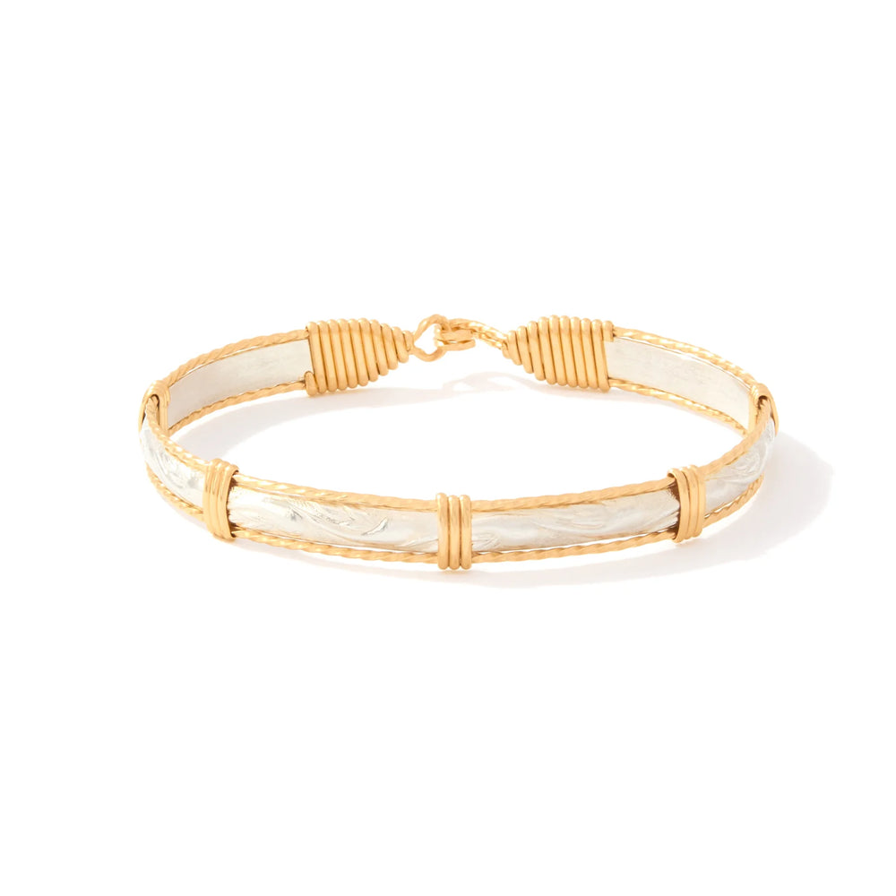 Gold and white bracelet on a white background