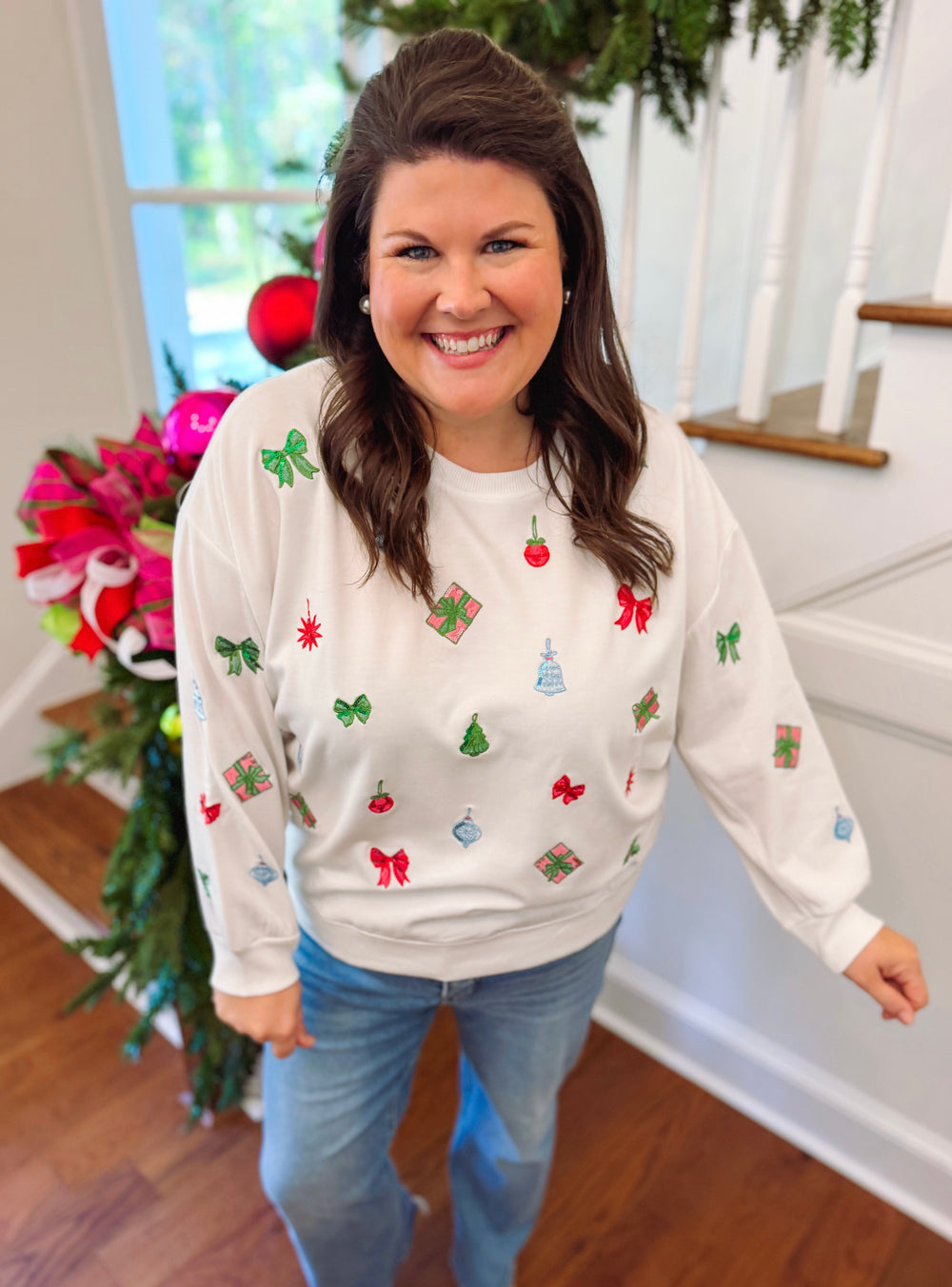 white sweatshirt with Christmas items on the front 