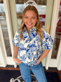 Blue and white floral cropped shirt with buttons down the front 